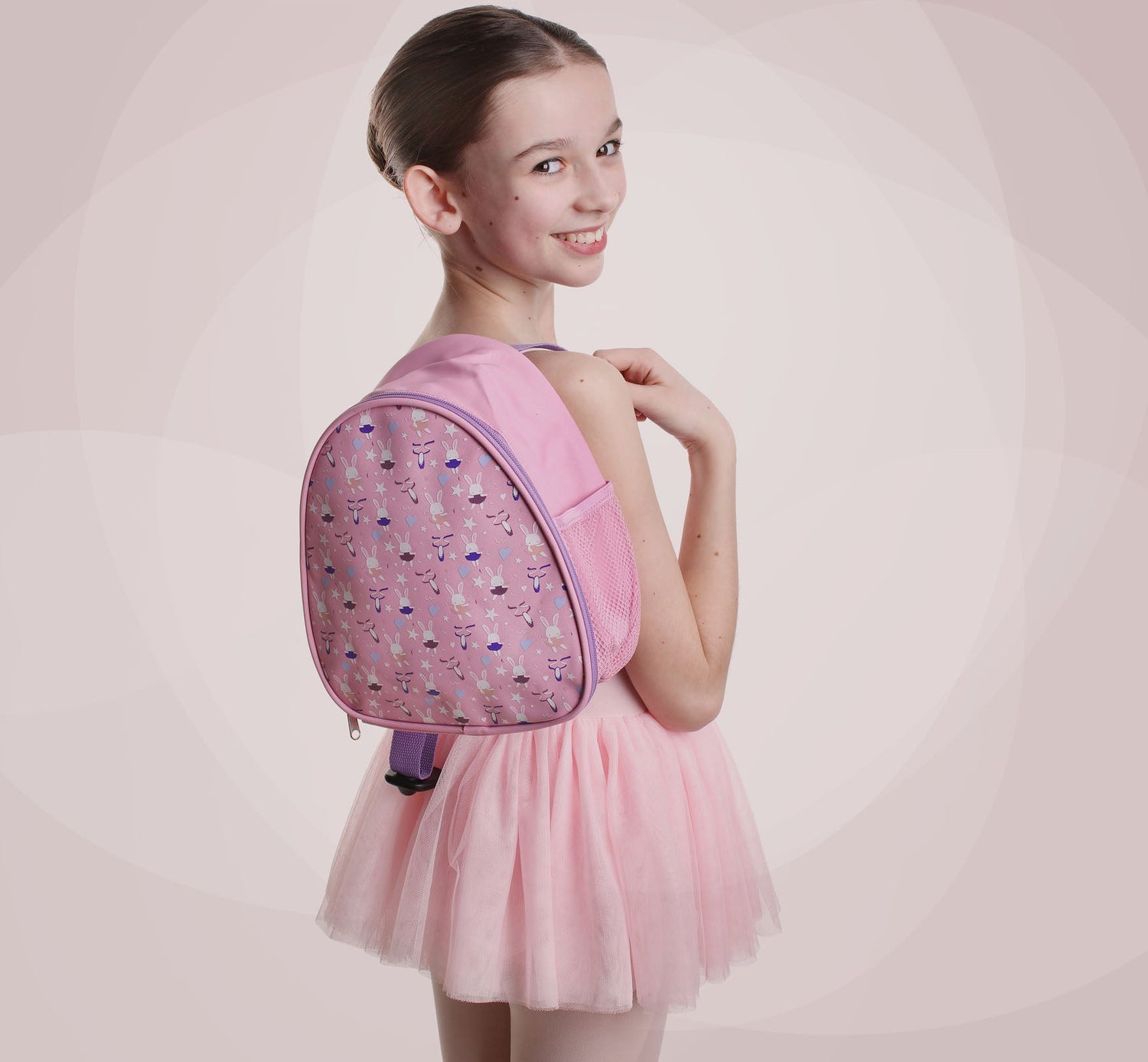 Young Ballerina Smiling and holding a BackPack